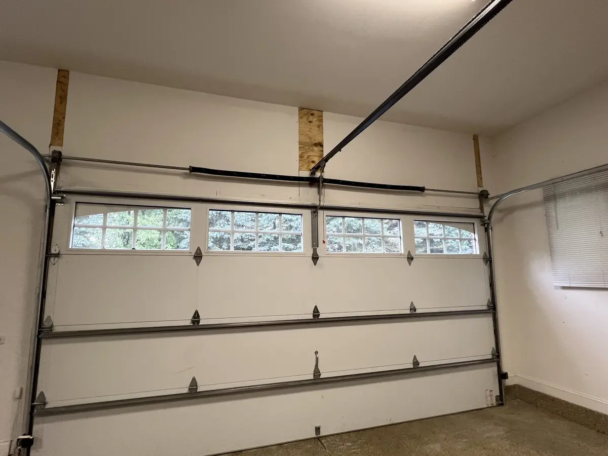 Elevate Your Garage Door: CHI Overlay Carriage House High Lift Conversion
